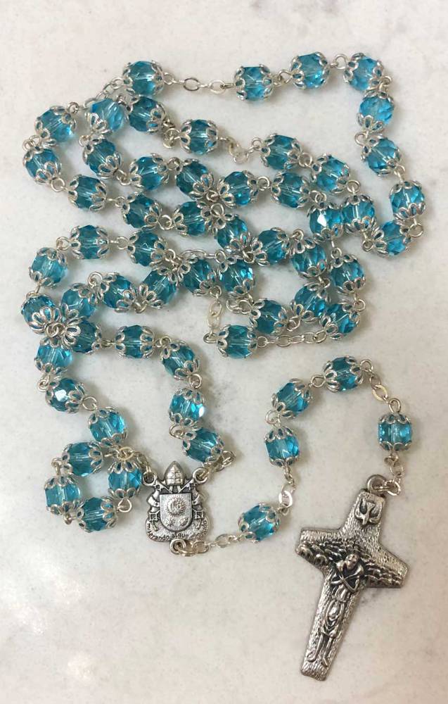 Pope Francis Aqua Colored Crystal Bead Rosary features Pope Francis' crest and Papal Crucifix. From Italy.